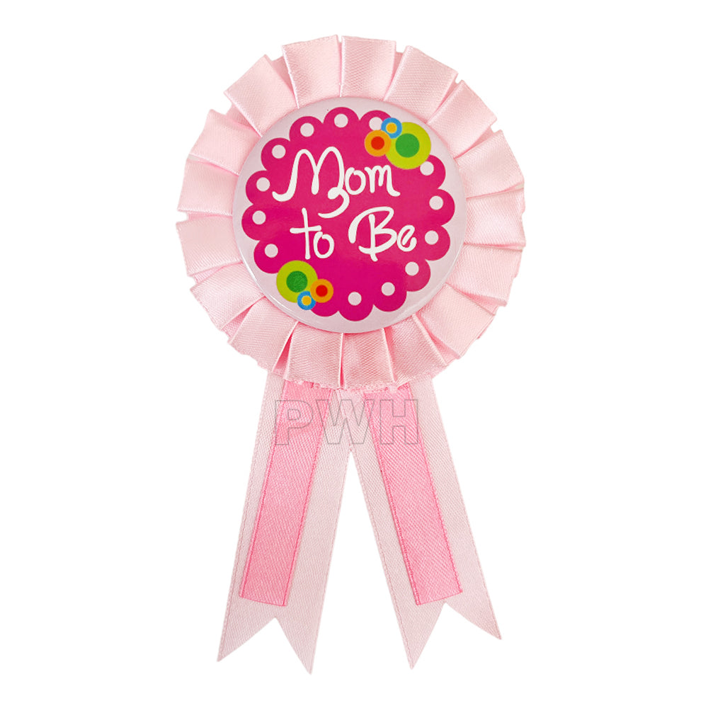 Premium pink Mom To Be satin badge for baby shower celebrations, gender reveal parties, maternity events, and motherhood celebrations from Party Wholesale Hub India.